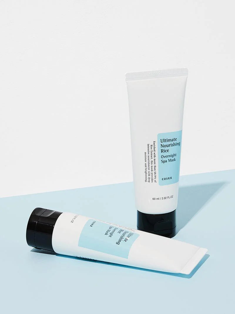 COSRX Ultimate Nourishing Rice Overnight Spa Mask tubes on a blue background, featuring 60ml size for deep skin nourishment.
