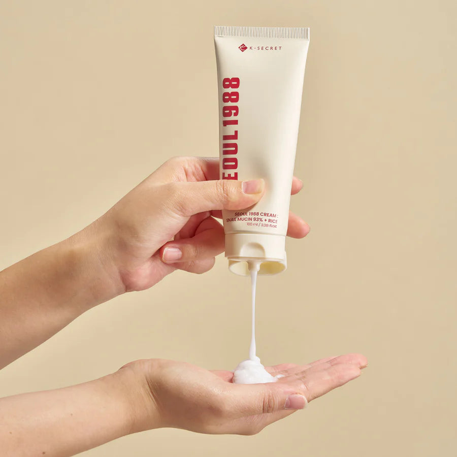 Applying KSECRET Seoul 1988 Cream with snail mucin