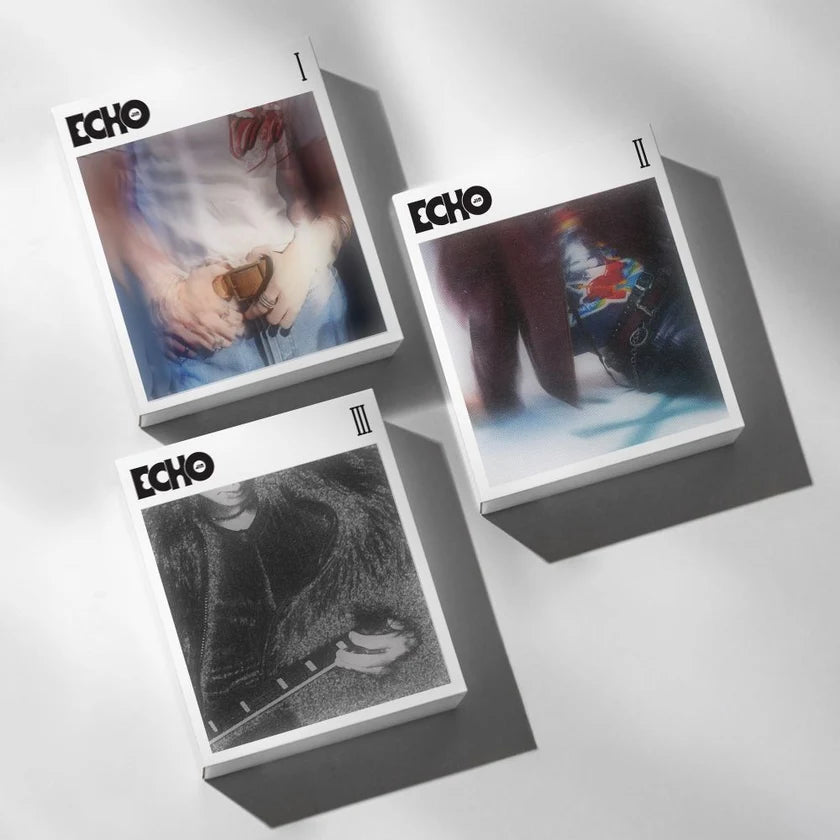 Three 'Echo' album covers on a reflective surface