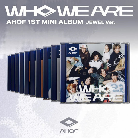 Album packaging for AHOF's 1st mini album 'WHO WE ARE' with multiple copies on a light gray background.
