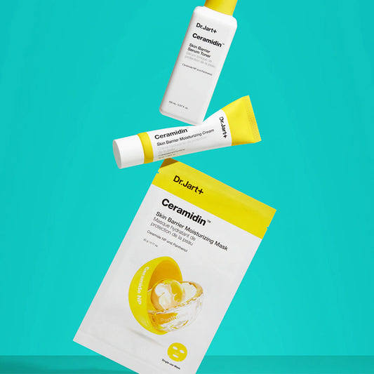Dr.Jart+ Ceramidin Skin Barrier Moisturizing Cream, Toner, and Mask against a blue background.